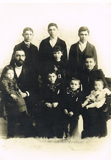 (back l-r) Ben L, Lou and Ike; (front) Ben holding Henry, Collie, Nate and Yetta holding Moe. Lena is center, in front of Lou